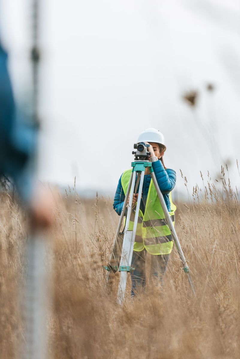 Saul Surveying crew member running a total station in a Mississippi field