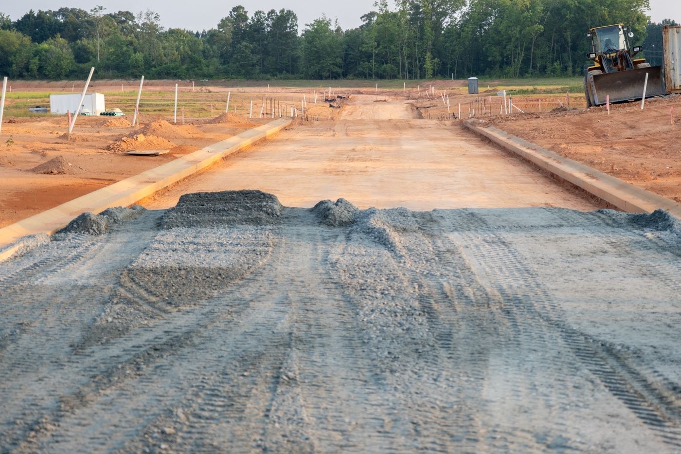 Graded construction pad and access road staked by a Saul Surveying crew in Jones County, MS